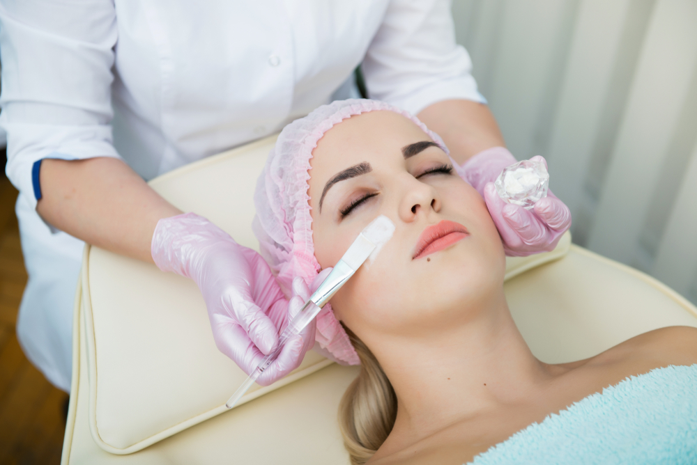 woman receiving a facial treatment at a spa