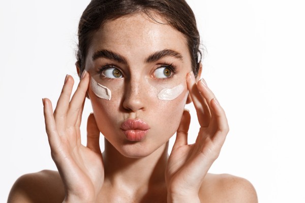 moisturizer on woman's face