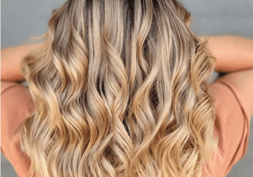 Blonde wavy hair from the back.